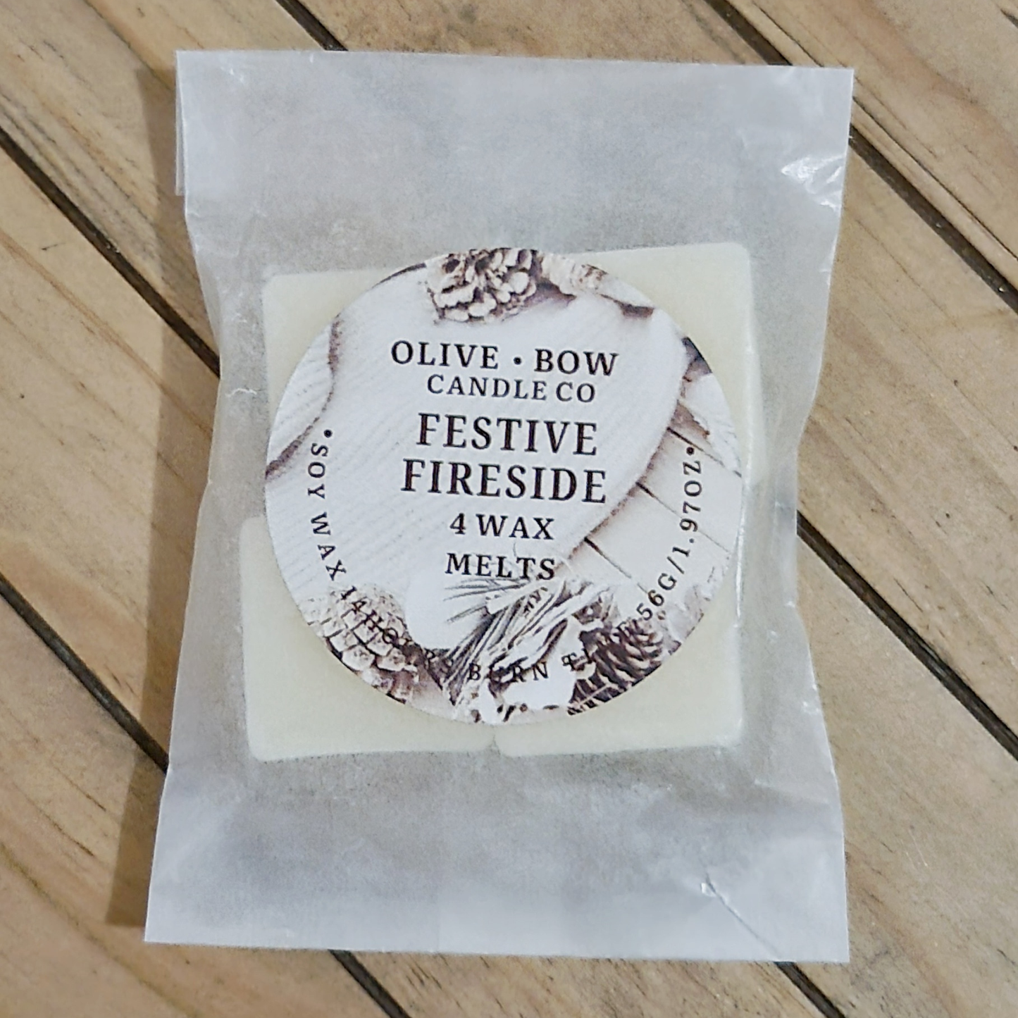 Pack of 4 soy wax melts in the cent Festive Fireside. Made by Olive Bow Candle Co