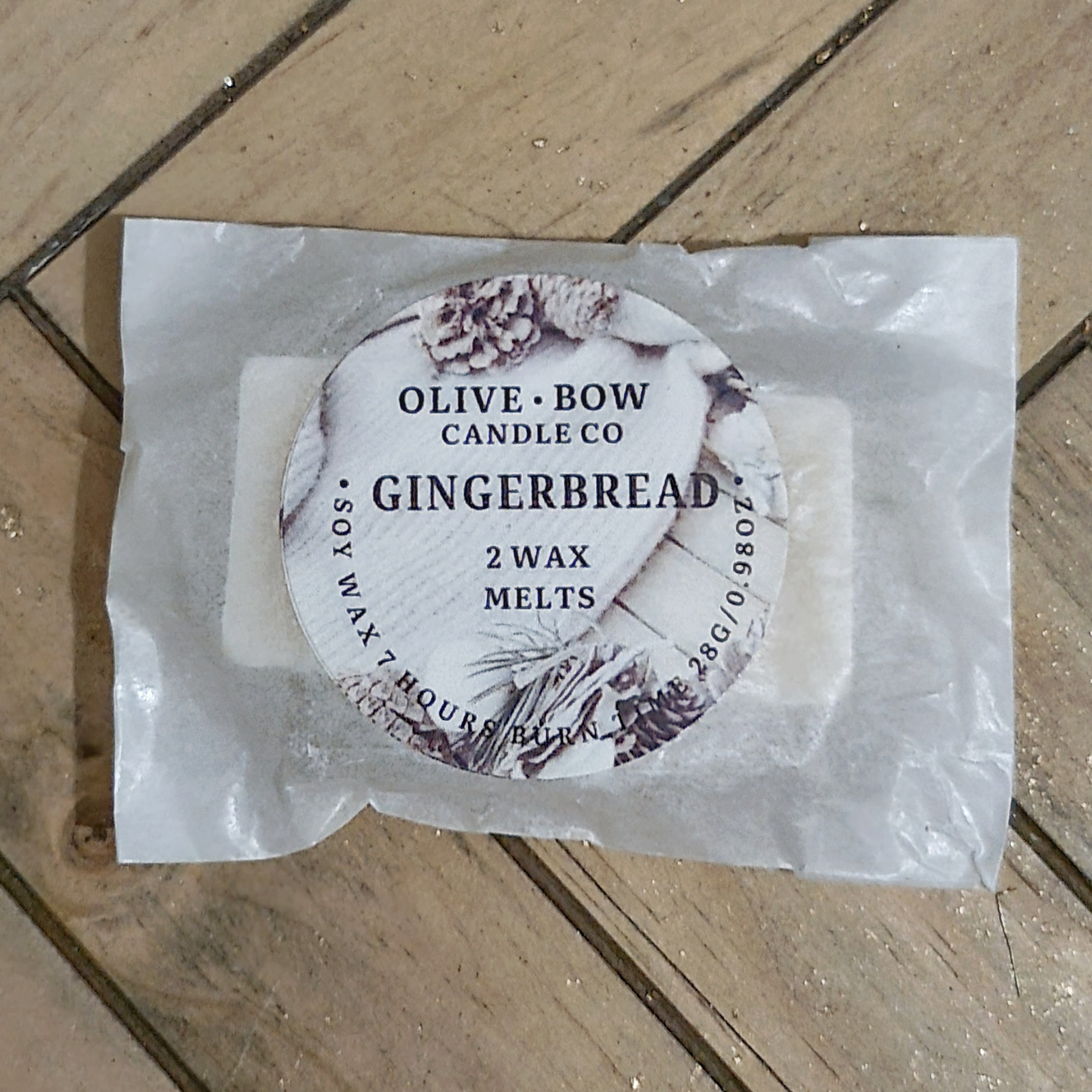 Olive Bow Candle Co gingerbread wax melts on a wooden surface
