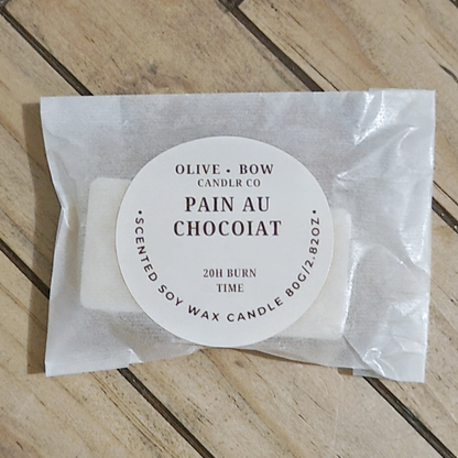 Soy wax melts in the scent Pain Au Chocolat, made by Olive Bow Candle Co