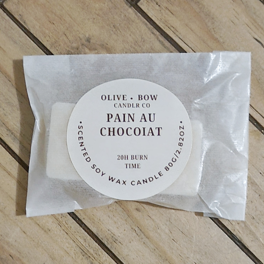 Soy wax melts in the scent Pain Au Chocolat, made by Olive Bow Candle Co