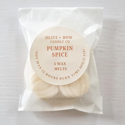 Packaged soy wax melts with 'Olive Bow Candle Co' label on a white background with the scent 'Pumpkin Spice'